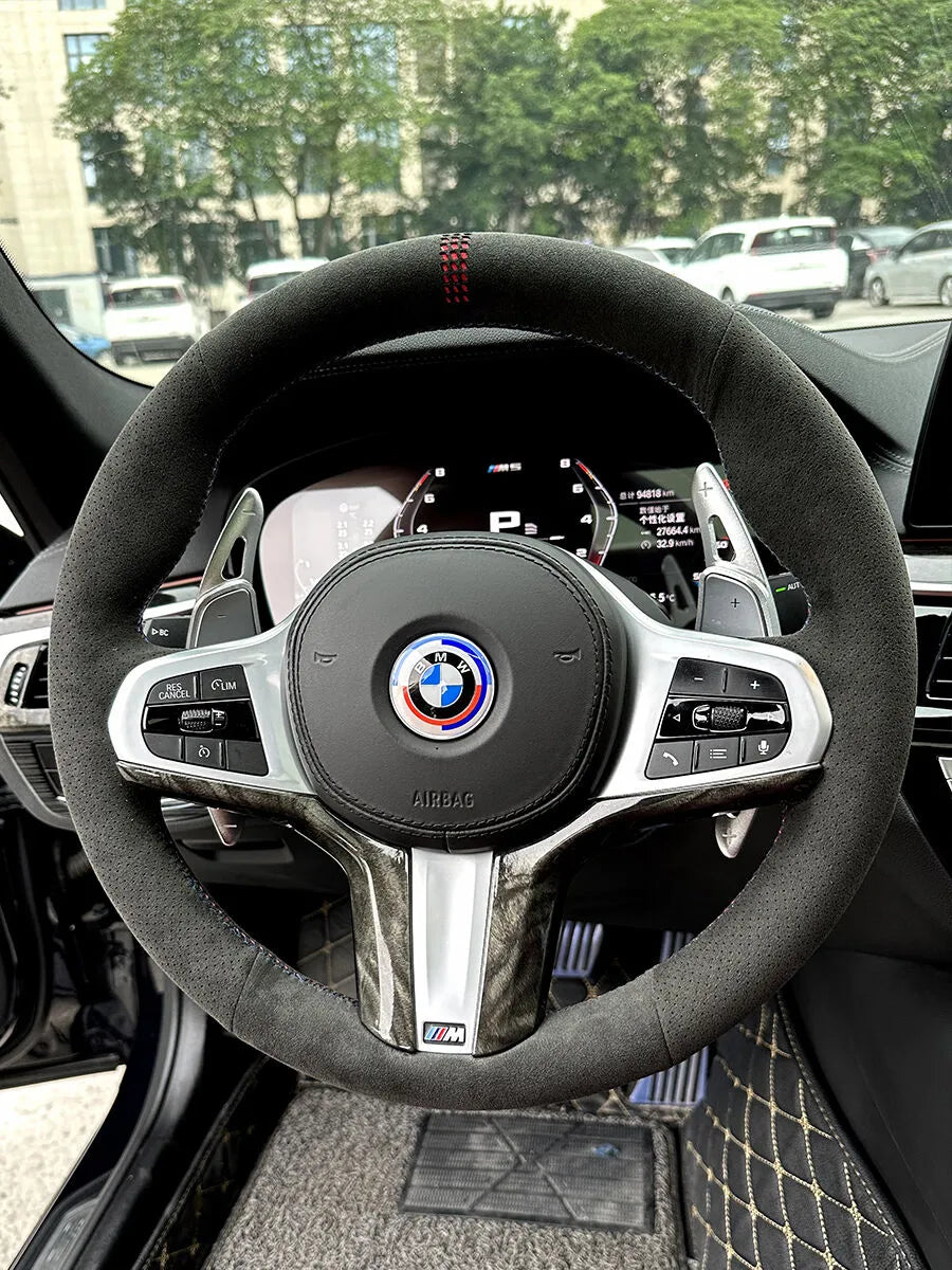 BMW custom steering wheel cover in dark gray Italian Alcantara with perforated grips and red center stitching
