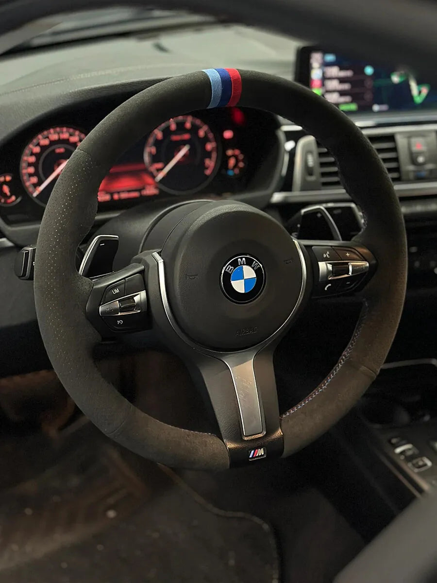 BMW custom steering wheel cover in dark gray Italian Alcantara with a uniform soft-touch finish