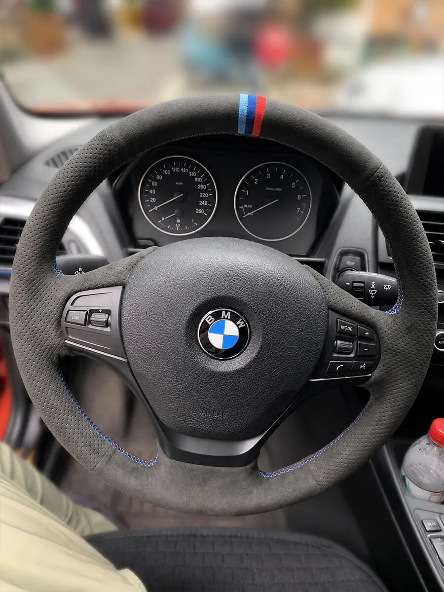 BMW custom steering wheel cover in dark gray Italian Alcantara with a m center marker and m stitching