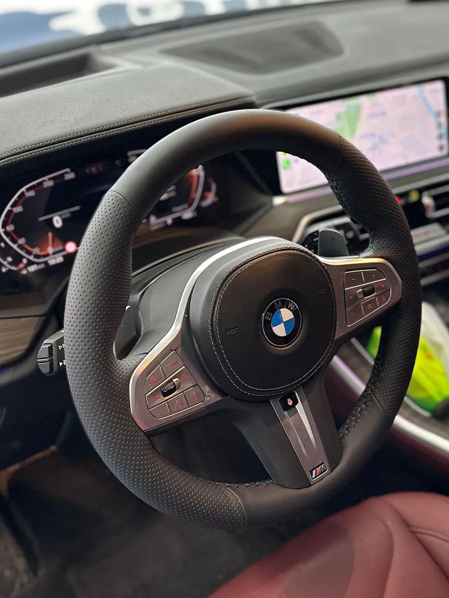 BMW custom steering wheel cover in black Nappa leather with smooth sections and perforated side grips