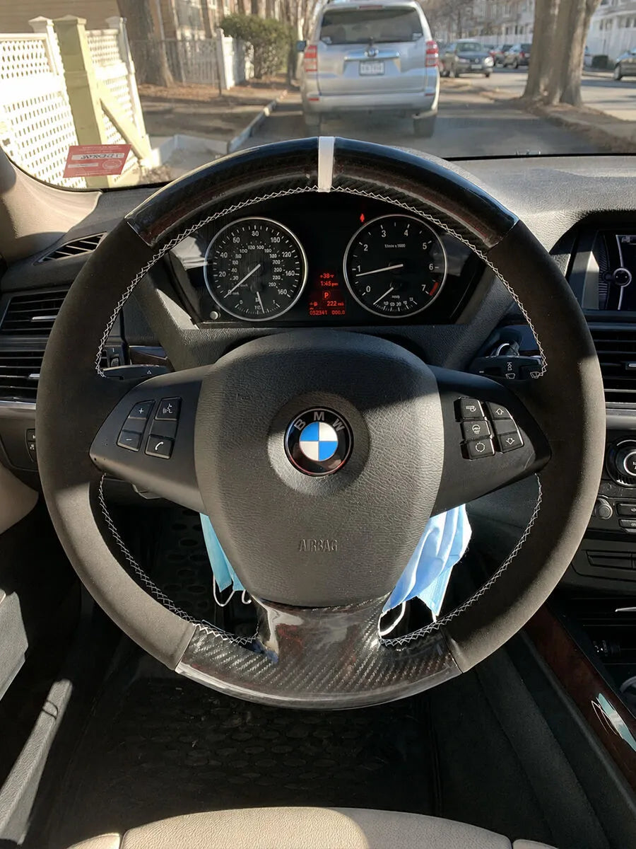 BMW custom steering wheel cover in black Nappa leather with a white center marker and white stitching