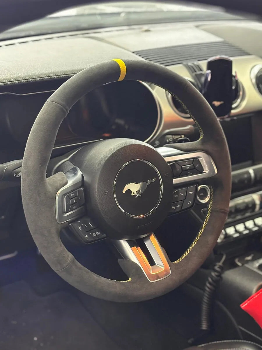 Ford custom steering wheel cover in gray Italian Alcantara with a yellow center marker and yellow stitching