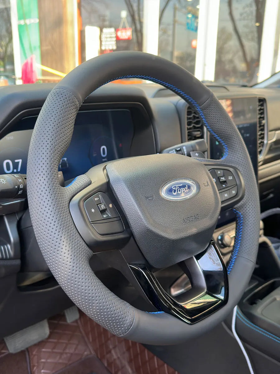 Ford custom steering wheel cover in gray perforated Nappa leather with blue contrast stitching
