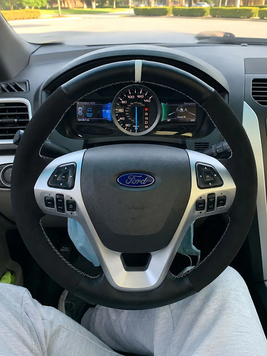 Ford custom steering wheel cover in black mixed materials with a white center marker and stitching