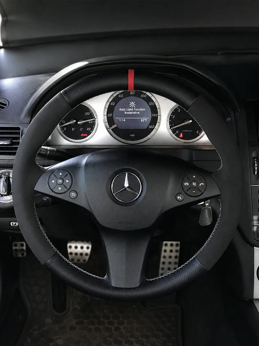 Mercedes-Benz custom steering wheel cover in black mixed materials with a red center marker and white stitching