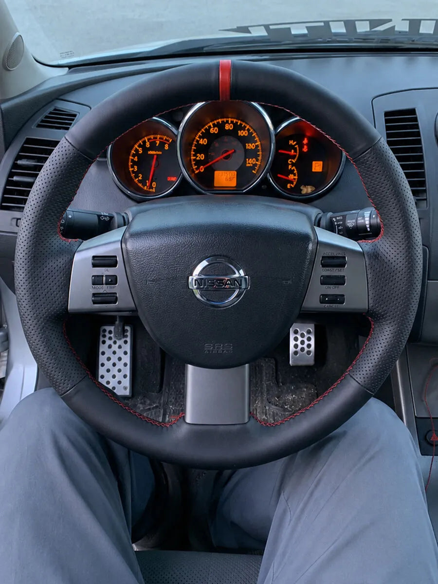 Nissan custom steering wheel cover in black Nappa leather with perforated grips and red stitching