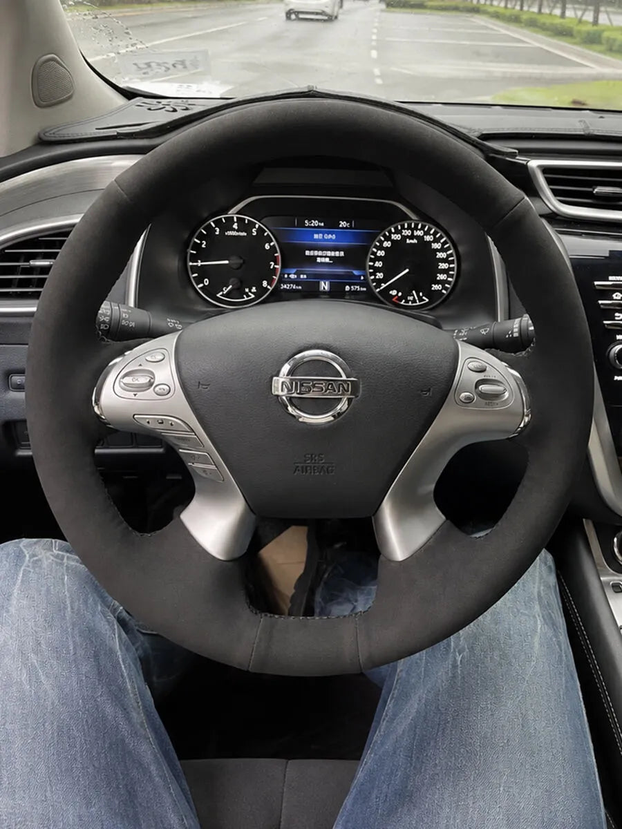 Nissan custom steering wheel cover in matte black mixed materials with a soft textured finish