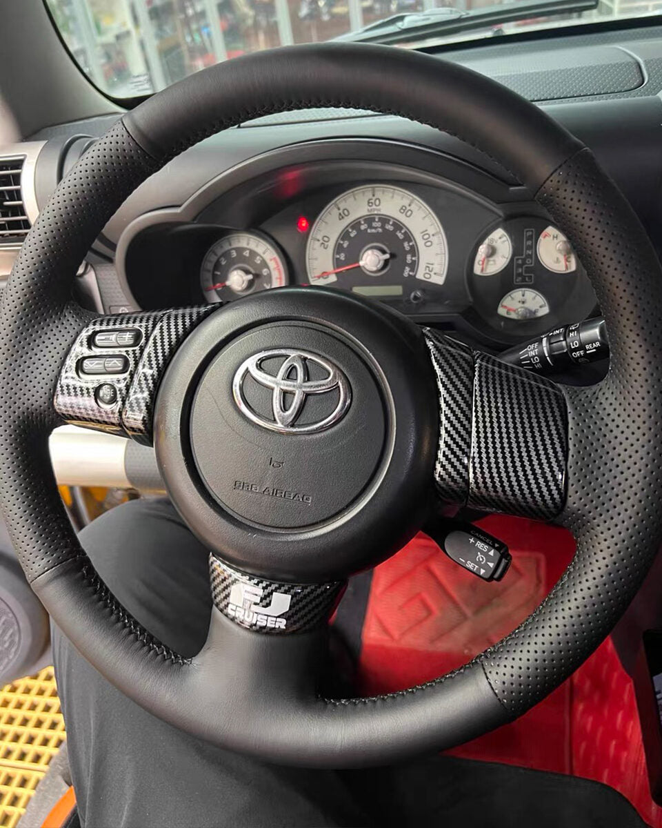 Toyota FJ Cruiser steering wheel with a full black Nappa leather cover