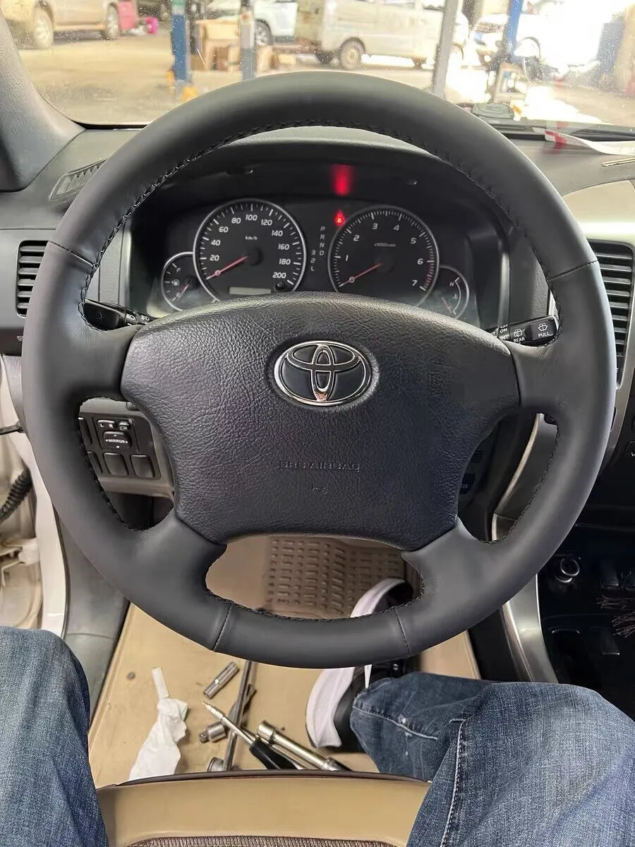 Toyota Tundra steering wheel with a full black Nappa leather cover