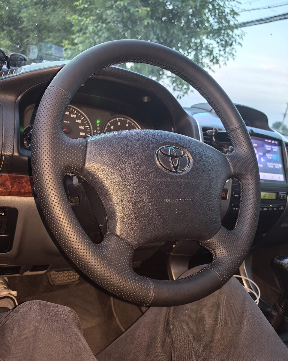 Toyota Tacoma steering wheel with a full black Nappa leather cover